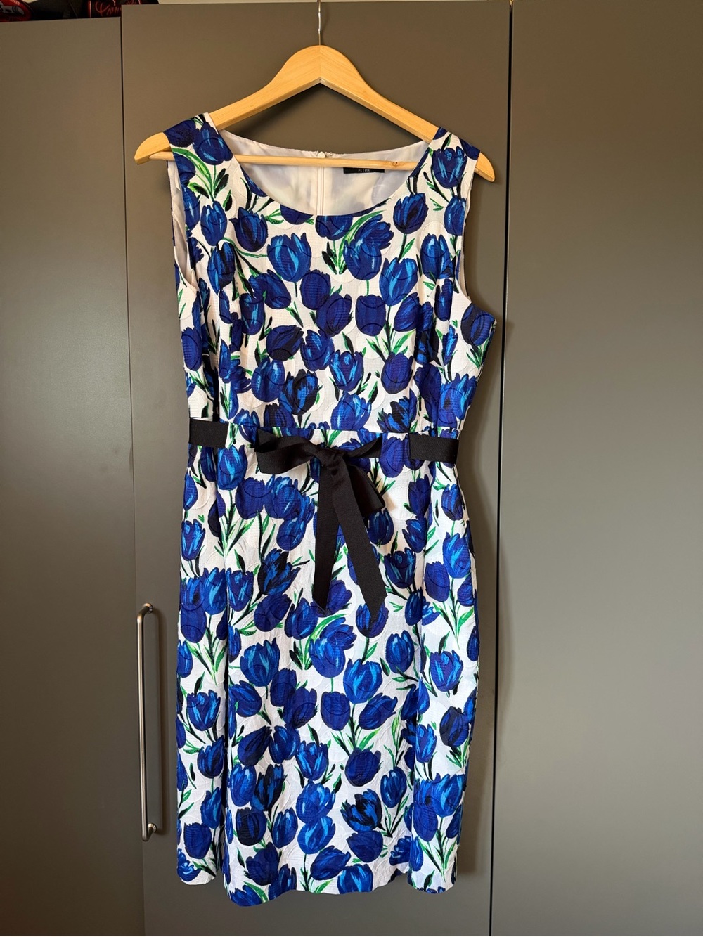 Sleeveless White Midi Dress with Blue Floral Print and Black Waist Tie